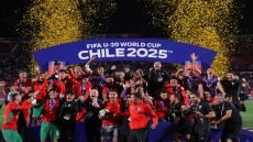 Morroco's team members celebrate with the trophy after winning the 2025 FIFA U-20 World Cup final football match between Argentina and Morocco at the National Stadium in Santiago on October 19, 2025. (Photo by Javier TORRES / AFP) (Photo by JAVIER TORRES/AFP via Getty Images)